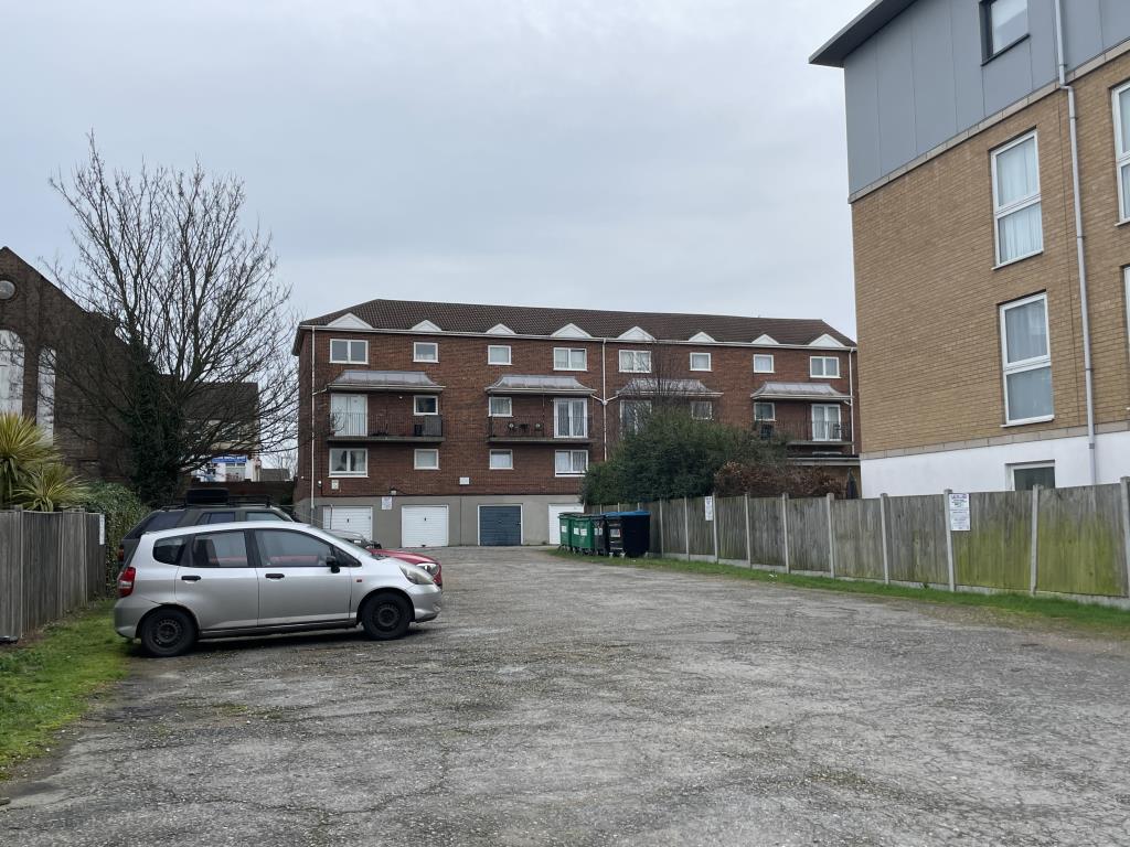 Lot: 97 - FREEHOLD INVESTMENT WITH SIXTEEN GARAGES AND GROUND RENT INVESTMENT - Rear view of Garage and Ground Rent Investment